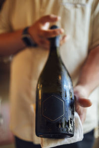 Cropped hand of woman holding wineglass