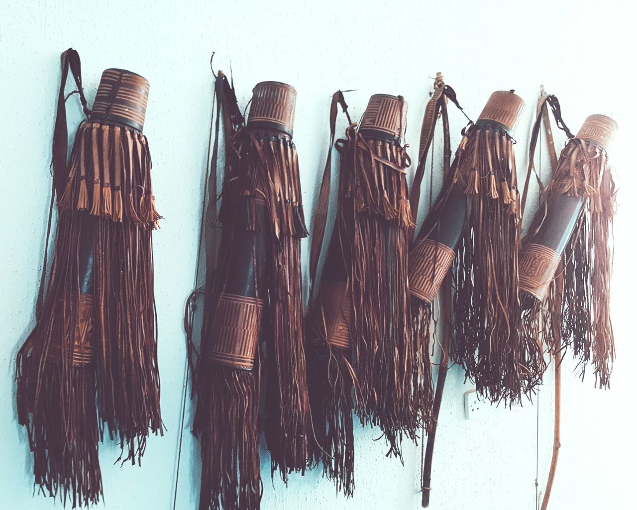 CLOSE UP OF UMBRELLAS ON WOOD