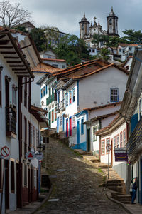 Narrow street amidst buildings in town