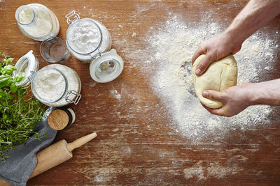 High angle view of person preparing cookies on table