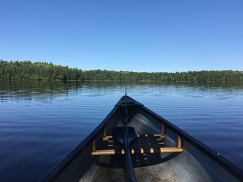 Scenic view of lake against clear blue sky