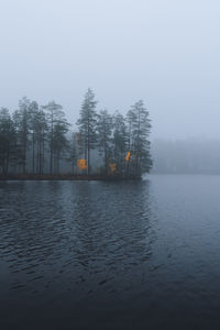 Scenic view of lake against sky during winter