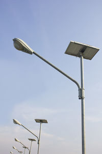 Low angle view of street light against sky