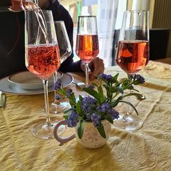 Close-up of wine glasses on table