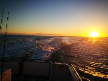 Scenic view of sea against clear sky during sunset