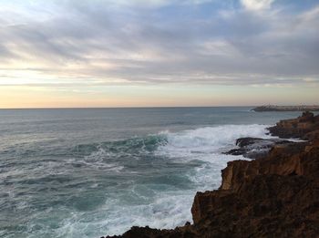 Scenic view of sea against dramatic sky