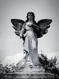 Low angle view of statue against sky