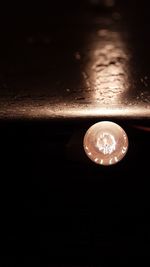Close-up of illuminated light bulb