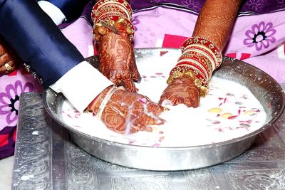 High angle view of woman preparing food on table