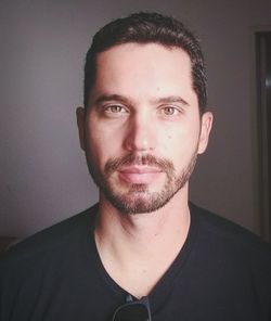 Portrait of young man at home