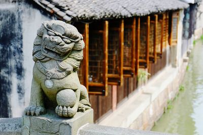 Statue against temple