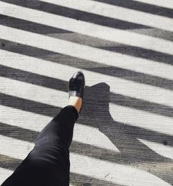 High angle view of human shadow on hand