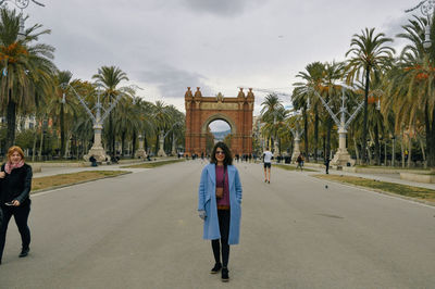 People walking in front of historical building