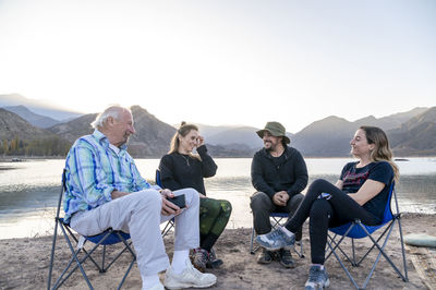 Family enjoying time together while relaxing outdoors in nature.