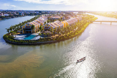 High angle view of river by city against sky