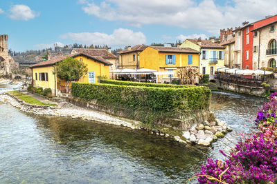 River amidst buildings in city