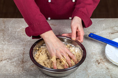 Midsection of man preparing food