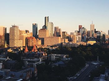 High angle view of buildings in city against clear sky