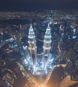 Aerial view of city lit up at night