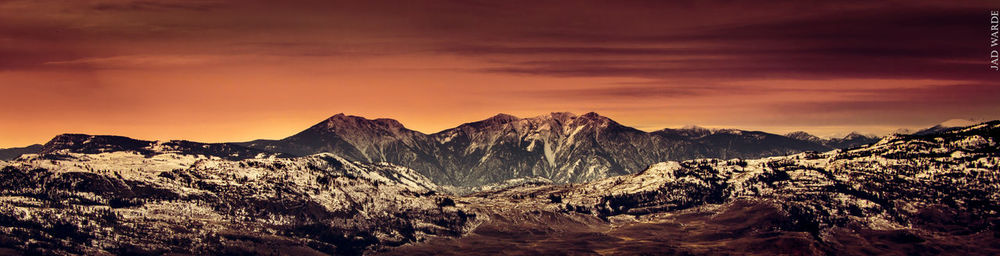 Scenic view of mountains against dramatic sky