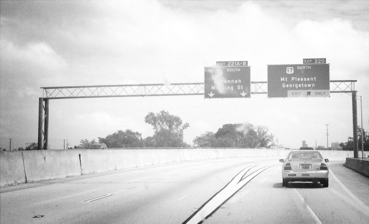 transportation, sky, snow, winter, road, weather, communication, road sign, text, cold temperature, western script, cloud - sky, information sign, guidance, car, land vehicle, sign, tree, street, the way forward