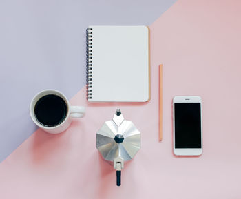 Coffee and mobile phone on desk