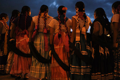 Group of people in market during night