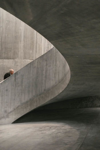 HIGH ANGLE VIEW OF PERSON WITH UMBRELLA