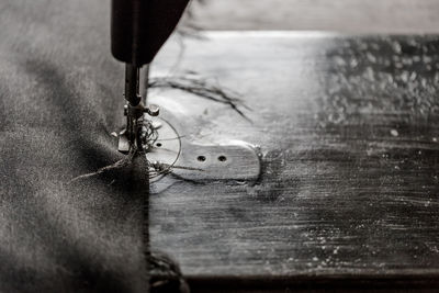 High angle view of fabric on sewing machine