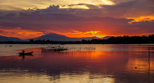 Scenic view of lake at sunset