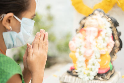 Girl praying god at home