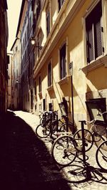 Bicycle against building in city