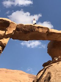 Low angle view of rock formation against sky