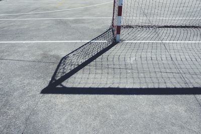 High angle view of broken net on road