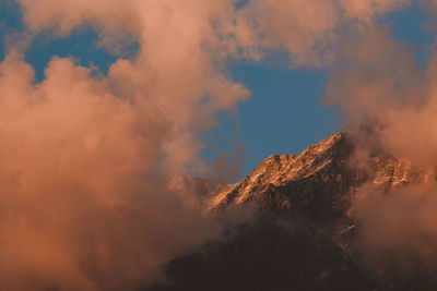 Low angle view of mountain against sky during sunset