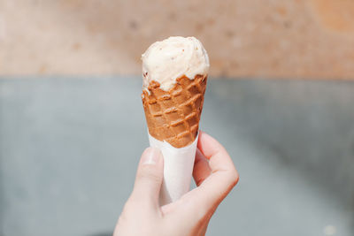 Close-up of ice cream cone in hand