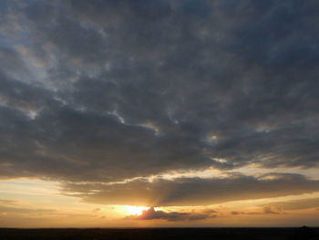 Scenic view of dramatic sky during sunset