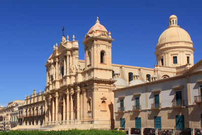 Low angle view of building against blue sky