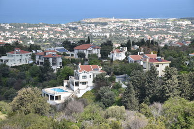 Houses in town against mountains