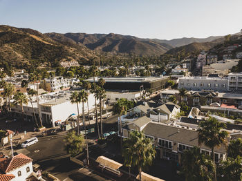 High angle view of townscape and mountains against sky