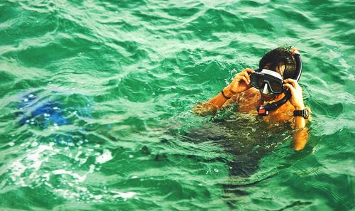 Man swimming in sea