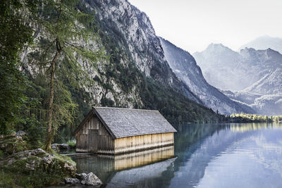 Scenic view of river with mountains in background