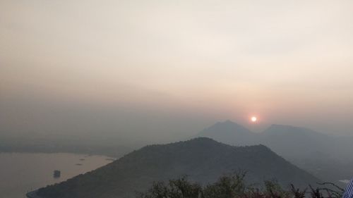 Scenic view of mountains against sky during sunset