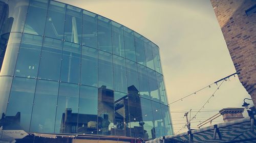 Low angle view of modern building against sky