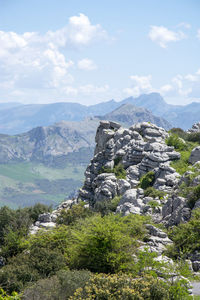 Scenic view of mountain against cloudy sky