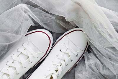 High angle view of shoe on bed