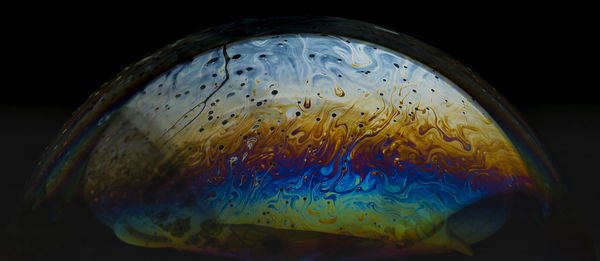 Close-up of light painting against black background