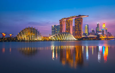 Illuminated city at waterfront