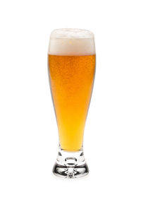 Close-up of beer glass against white background