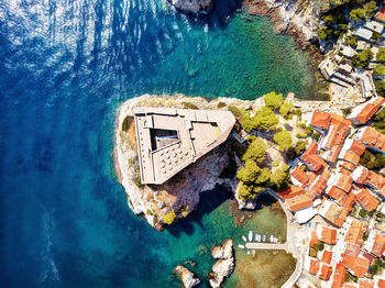 High angle view of swimming pool by building